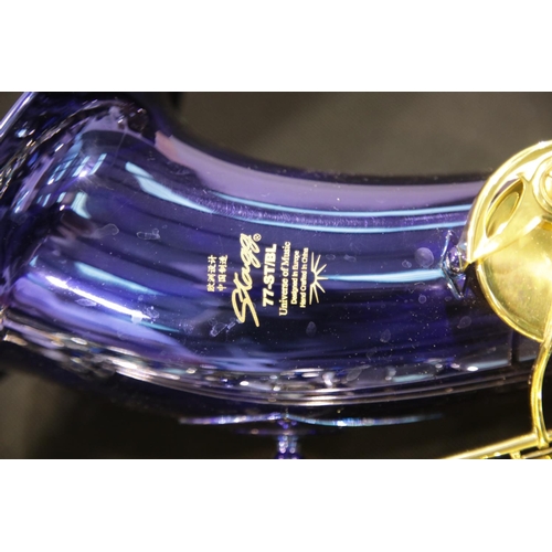 1521 - Stagg Bb tenor saxophone in blue model 77-ST/B2 in an ABS case, believed to be complete. P&P Group 3... 