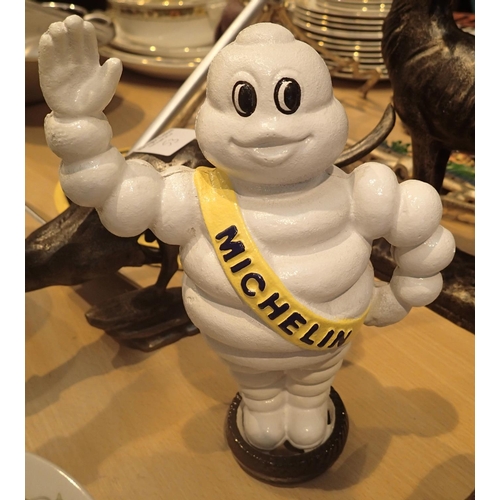 7 - Cast iron Michelin Man waving on tyre moneybox, H: 22 cm. P&P Group 2 (£18+VAT for the first lot and... 