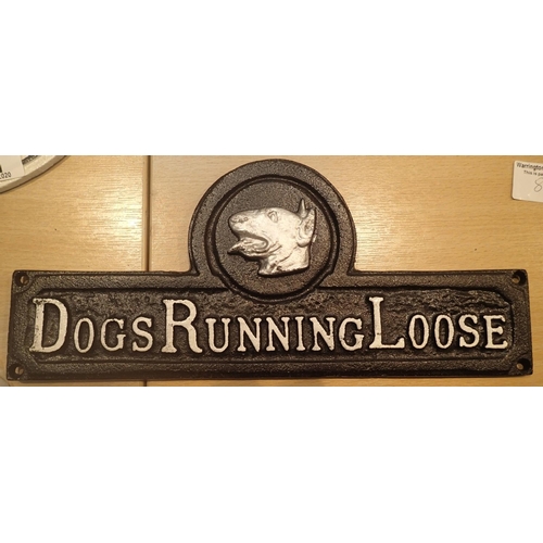 28 - Cast iron sign Dogs Running Loose. P&P Group 2 (£18+VAT for the first lot and £2+VAT for subsequent ... 