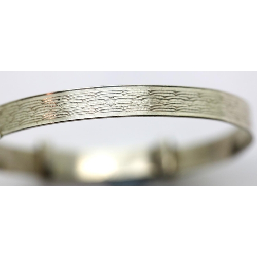 1236 - Sterling silver heavy baby bangle, W: 6 mm, D: 4.4 cm. P&P Group 1 (£14+VAT for the first lot and £1... 