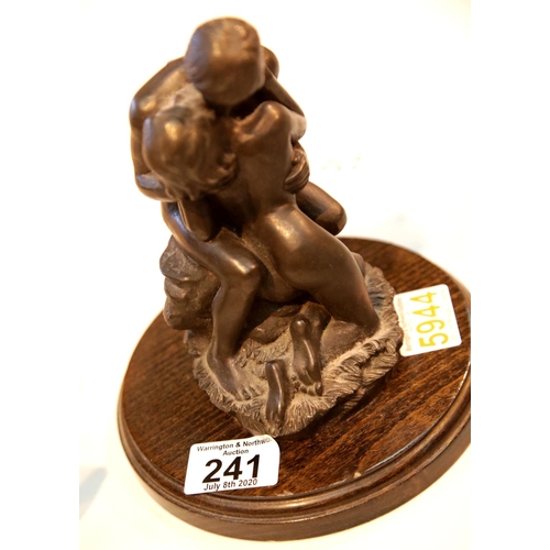 241 - Bronze effect sculpture of male and female on a wooden base. This lot is not available for in-house ... 