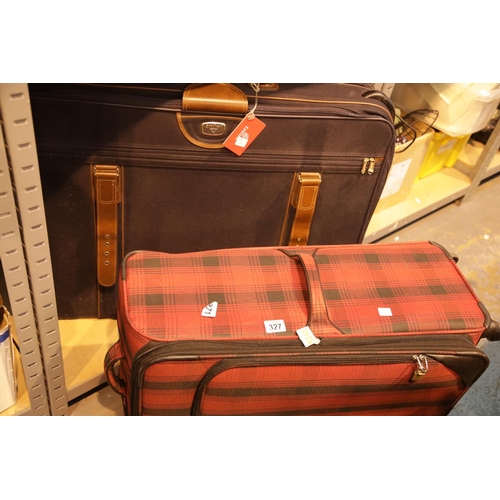 327 - Two modern suitcases. This lot is not available for in-house P&P.