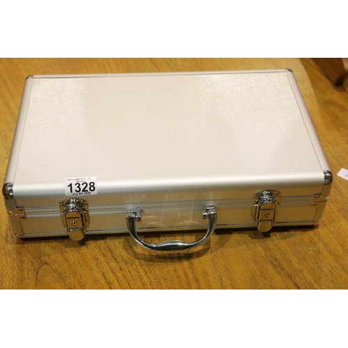 1328 - Aluminium coin case with worldwide coin contents including some silver. P&P Group 2 (£18+VAT for the... 