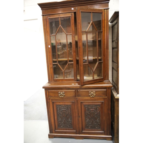 1657 - Edwardian glazed bookcase with two drawers and two cupboards 109 x 45 x 220 cm H. This lot is not av... 