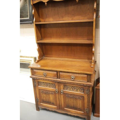 1660 - 20th century Old Charm style oak dresser, the two tier plate rack sits above a sideboard base of cup... 