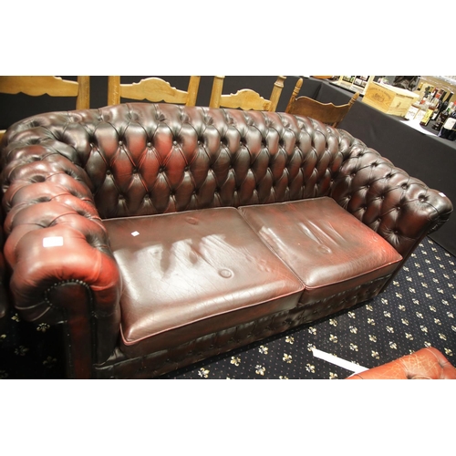 1666 - Oxblood red leather button back three seater Chesterfield sofa. This lot is not available for in-hou... 