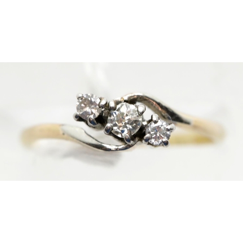 1629 - 18ct gold claw set three stone diamond crossover ring, size K/L. P&P Group 1 (£14+VAT for the first ... 
