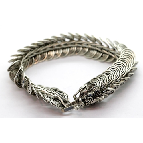 1651 - White metal Tibetan silver linked dragon bracelet, L: 20 cm. P&P Group 1 (£14+VAT for the first lot ... 