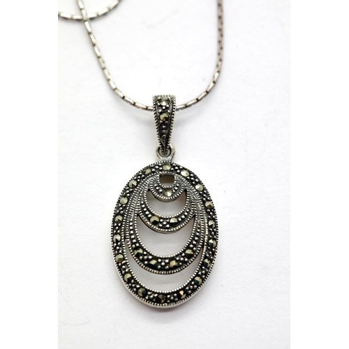 1659 - Two 925 silver pendants, one amber the other marcasite. P&P Group 1 (£14+VAT for the first lot and £... 