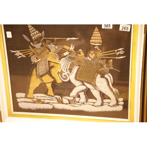 265 - Framed and glazed fighting elephants print on cotton. This lot is not available for in-house P&P.