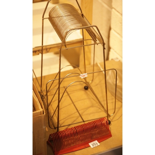 253 - 1970s wire LP rack and similar 45RPM rack. This lot is not available for in-house P&P.