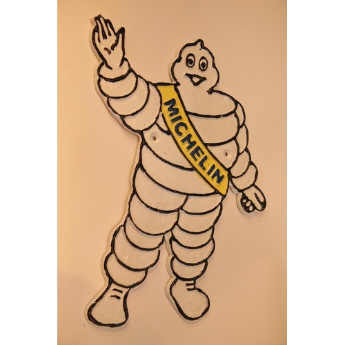 11 - Cast iron Michelin Man wall figurine, H: 33 cm. P&P Group 2 (£18+VAT for the first lot and £2+VAT fo... 