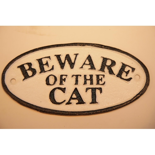 25 - Cast iron Beware of The Cat sign, 17 x 9 cm. P&P Group 2 (£18+VAT for the first lot and £2+VAT for s... 