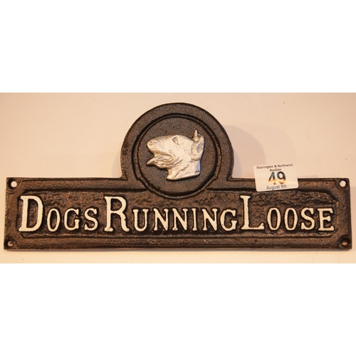 49 - Cast iron Dogs Running Loose sign, 32 x 13 cm. P&P Group 2 (£18+VAT for the first lot and £2+VAT for... 