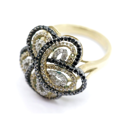 1134 - 9ct gold flower head ring set with a multitude of clear, champagne and black diamonds, size P, 5.2g.... 