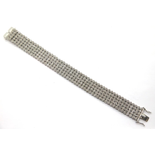 1163 - Silver diamond set tennis bracelet containing approximately 7cts diamonds in 1,820 stones, L: 19 cm.... 