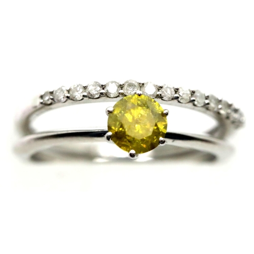 1170 - 9ct white gold diamond set half eternity ring and a 9ct white gold yellow stone solitaire ring, both... 