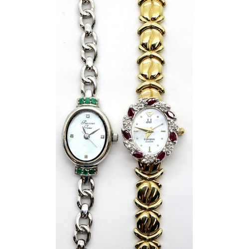 1250 - Two ladies wristwatches, one with emerald set bezel, the other set with rubies and diamonds.  P&P Gr... 