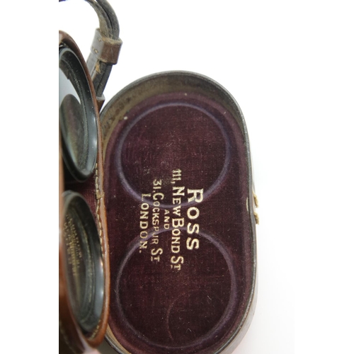 3153 - Ross of London, a pair of Royal Field Artillery binoculars X5 2 7/16, in stamped leather case, also ... 