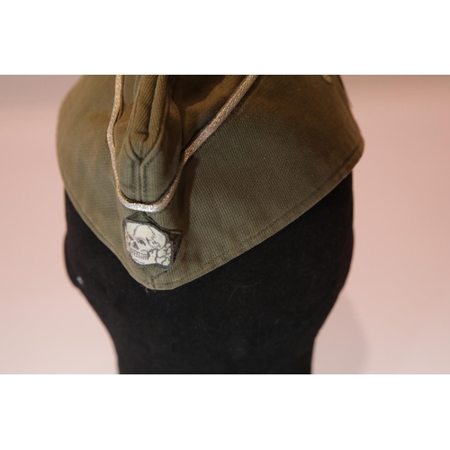 3185 - German WWII type SS side cap with silvered piping, bearing stamps inside and dated 1944. P&P Group 1... 