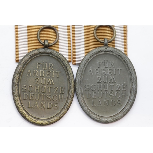 3462 - Two German WWII type West Wall medals with ribbons, silver and bronze, in packets of issue. P&P Grou... 