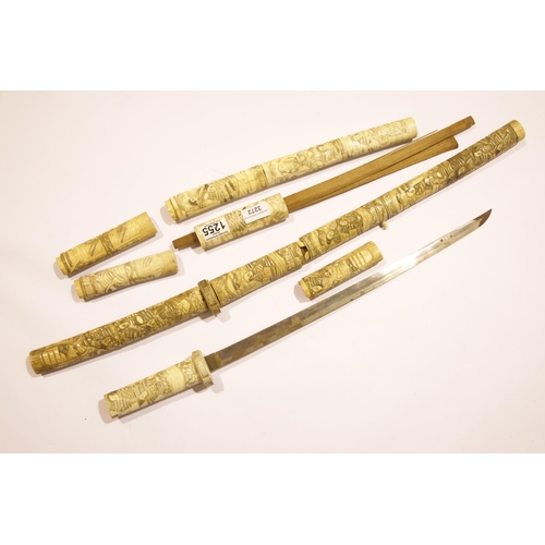 3272 - Heavily carved pair of late 19th century Japanese ivory Wakizashi swords. Both are complete but scab... 