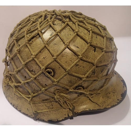 3188A - German WWII type helmet with soft netting, no chin strap but original shell and liner. Net and outsi... 