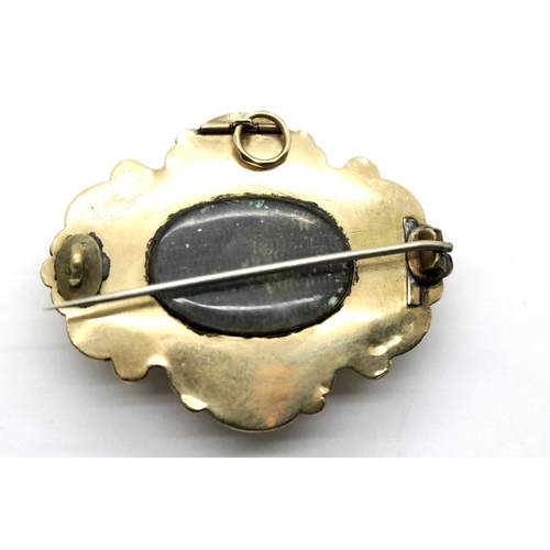 1003 - Victorian yellow metal mourning brooch with agate centre and vacant lock of hair panel to verso, L: ... 