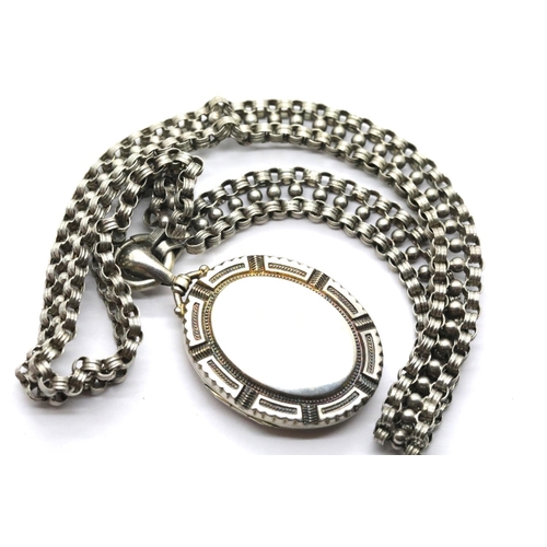 1028 - White metal locket on a similar chain. Locket L: 4 cm, chain L: 40 cm approximately. P&P Group 1 (£1... 