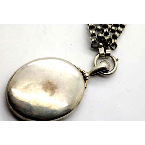 1028 - White metal locket on a similar chain. Locket L: 4 cm, chain L: 40 cm approximately. P&P Group 1 (£1... 