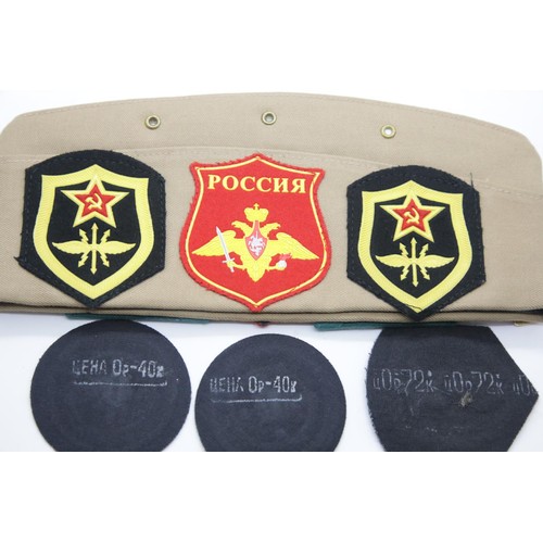 3413 - Russian side cap mounted with various Russian military badges and patches. P&P Group 1 (£14+VAT for ... 