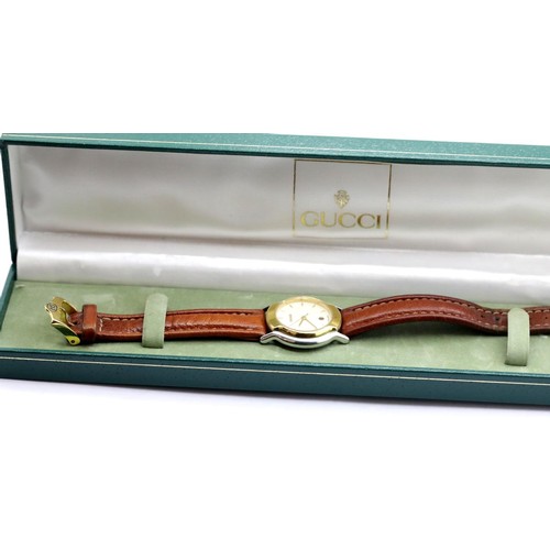 1065 - Ladies Gucci gold plated and stainless steel wristwatch with champagne dial and original Gucci brown... 