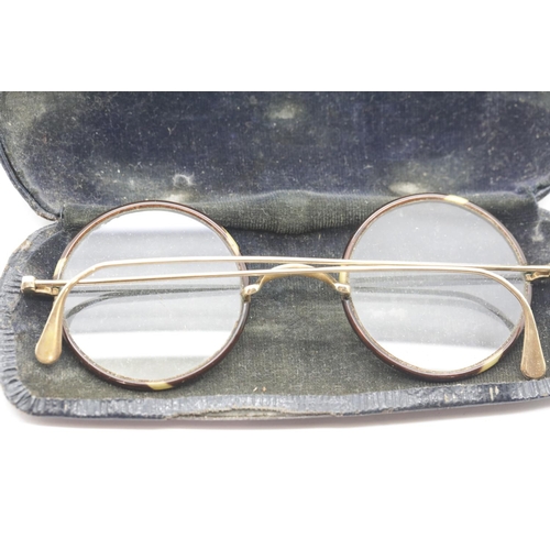 1083 - Pair of unmarked yellow metal (possibly gold) and tortoiseshell rimmed circular glasses with origina... 