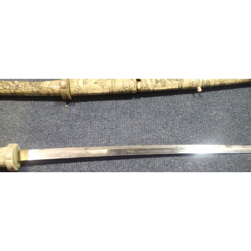 3272 - Heavily carved pair of late 19th century Japanese ivory Wakizashi swords. Both are complete but scab... 