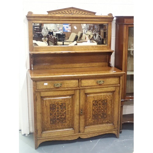 1770 - Arts and Crafts Golden Oak mirror back sideboard having carved cupboard doors and two short drawers.... 