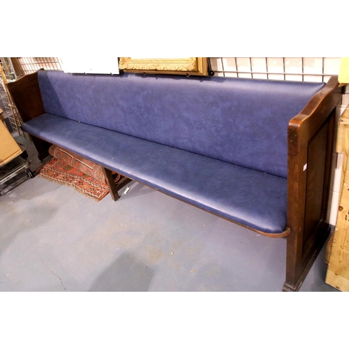 1794 - Oak church pew with centre leg and hymnal shelf to back, with upholstered seat and back rest. L: 261... 