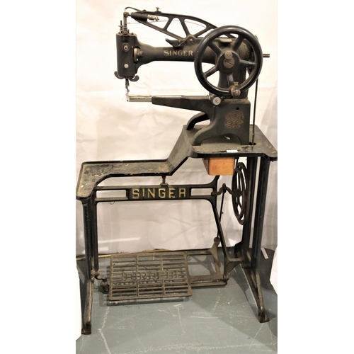 3118 - Vintage Singer leather sewing machine model 29K71 on a cast iron treadle base. Not available for in-... 