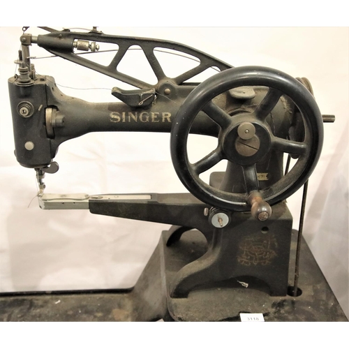 3118 - Vintage Singer leather sewing machine model 29K71 on a cast iron treadle base. Not available for in-... 