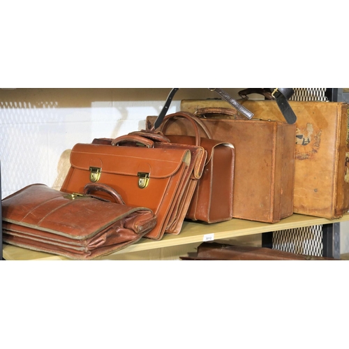 3012 - Two vintage leather suitcases, a pilot's case and three briefcases. Not available for in-house P&P