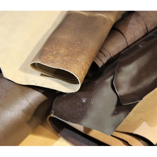 3056 - Quantity of rolled dark brown leather. Not available for in-house P&P