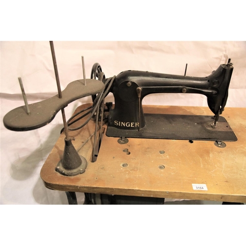 3104 - Singer leather sewing machine with motor, on a cast iron base. Not available for in-house P&P