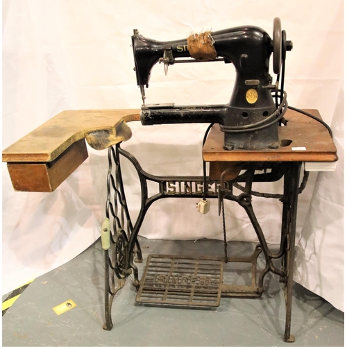 3116 - Vintage Singer leather sewing machine on a shaped cast iron stand, model 17-16, serial AH479911, wit... 