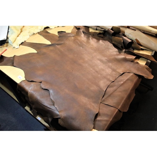 3058 - Three small full and one part brown leather part hides. P&P Group 3 (£25+VAT)