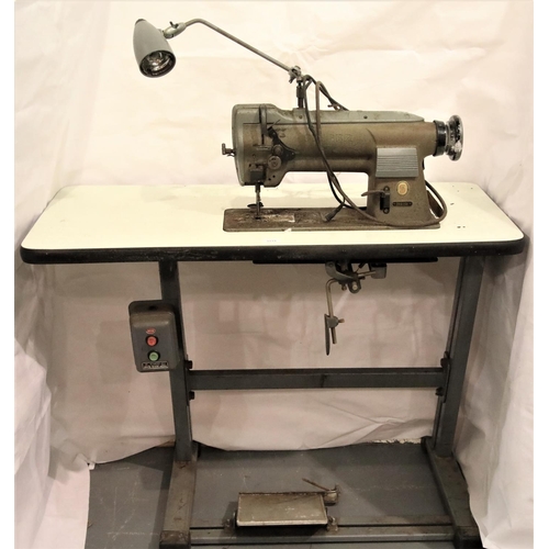 3119 - Vintage Singer electric leather sewing machine model 211G256, on a steel base. Not available for in-... 