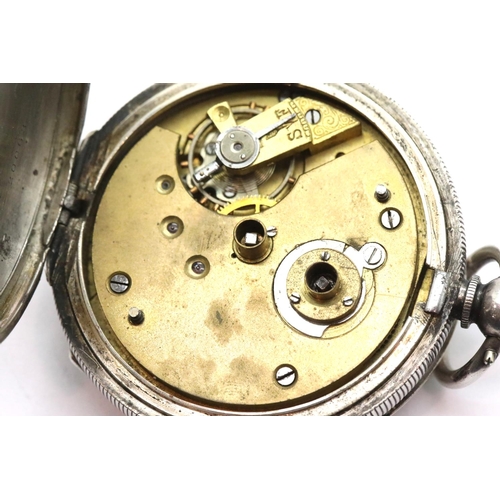 1018 - Continental 935 silver pocket watch and key, working at lotting. P&P Group 1 (£14+VAT for the first ... 