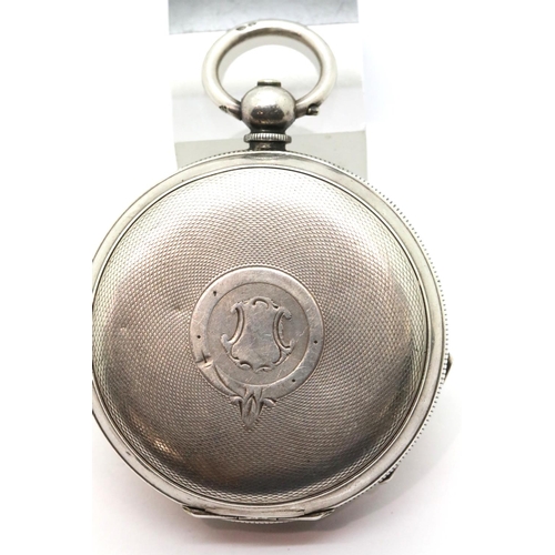 1018 - Continental 935 silver pocket watch and key, working at lotting. P&P Group 1 (£14+VAT for the first ... 