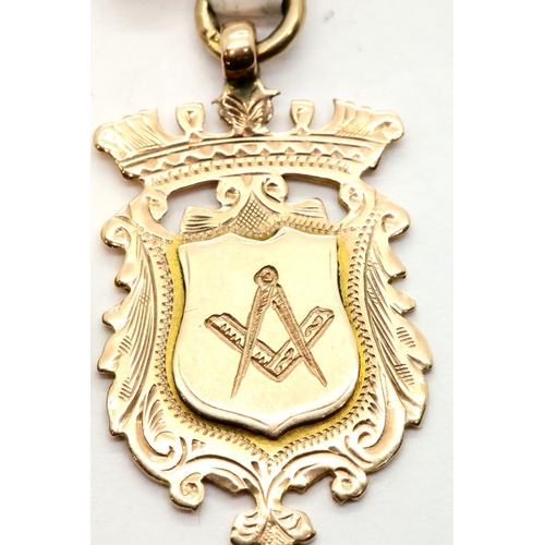 1033 - 9ct rose gold watch chain fob engraved with Masonic square and compass, 5.8g. P&P Group 1 (£14+VAT f... 