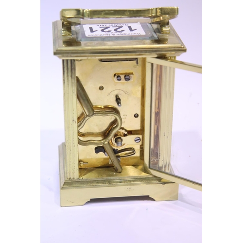 1221 - Brass carriage clock by Cottrills with key, having visible escapement. P&P Group 2 (£18+VAT for the ... 