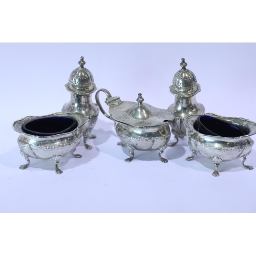 1258 - George V hallmarked silver five piece cruet, comprising a pair of open salts each with Bristol blue ... 