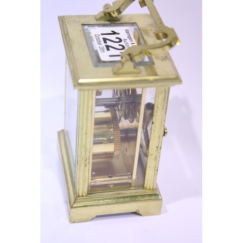 1221 - Brass carriage clock by Cottrills with key, having visible escapement. P&P Group 2 (£18+VAT for the ... 